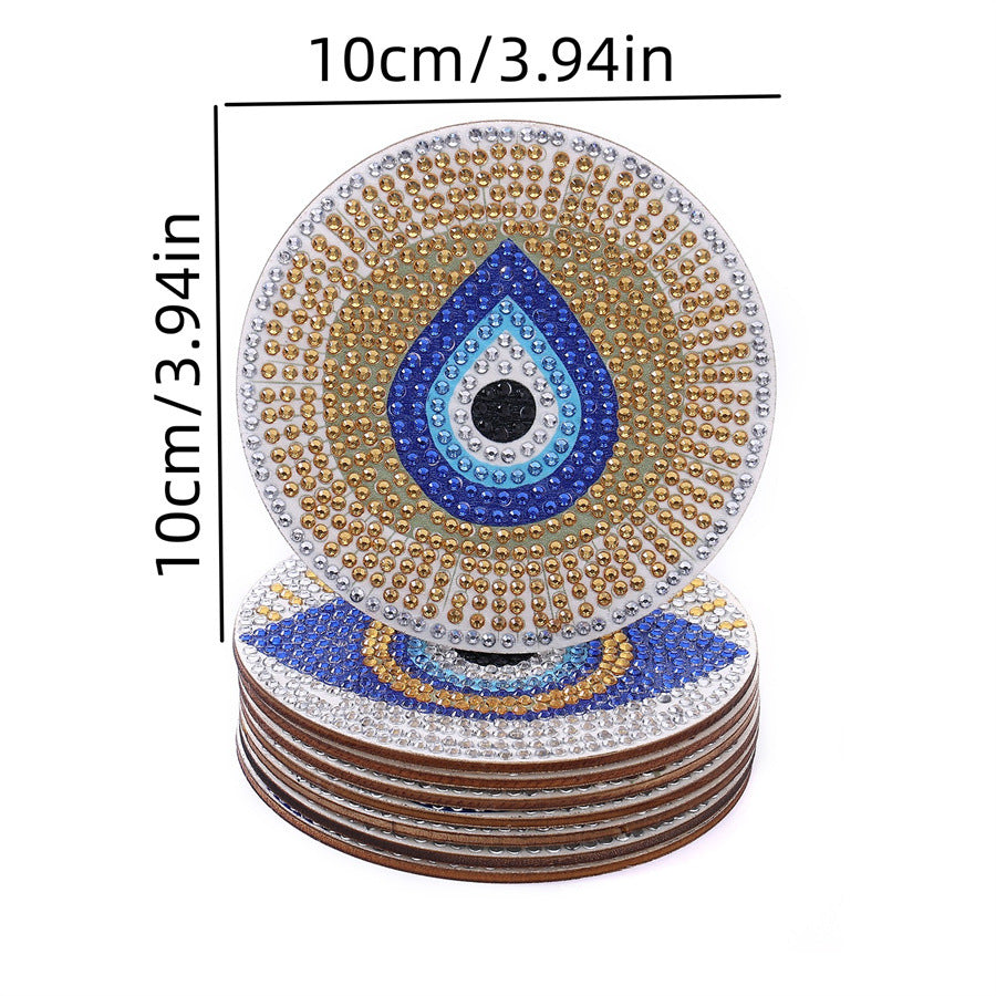 Blue teardrop diamond coaster with concentric eye design, stacked with brown edges